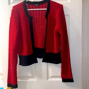 Classic red and black no button cardigan.  Reitman’s XL fits more like a large